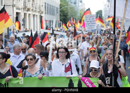 09 June 2018, Germany, Berlin: People taking part in a 'Frauenmarsch' (lit. women's march) by right-wing populist groups. Photo: Jörg Carstensen/dpa Stock Photo