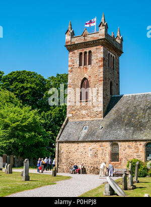 Dirleton Village Gardens, Scotland’s Gardens Scheme 2018, 9th June 2018. Dirleton Village, East Lothian, Scotland, United Kingdom. The square church tower with a RNLI flag flying on the top on a sunny day with blue sky Stock Photo