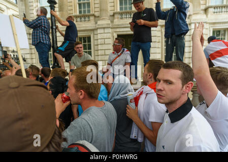 London, UK. June 9th 2018. Several thousand protesters march down from  Trafalgar Square to a rally in Whitehall. An angry crowd stopped in front of Downing Street where two thugs attempted to grab me and pull my camera from my hand to prevent me taking pictures.  I managed to pull away and move through the dense crowd, but they followed me through the mass of people for some distance repeatedly trying to take my cameras and camera bag until I got close to the police and march stewards in front of Downing St. Credit: Peter Marshall/Alamy Live News Credit: Peter Marshall/Alamy Live News