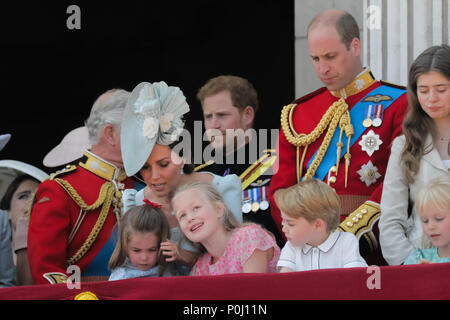London, UK. 9th June 2018. Prince George looks concerned as his mother, HRH Catherine, Duchess of Cambridge, comforts his sister, Princess Charlotte after she takes a fall on the balcony at Buckingham Palace during the flypast at the end of Trooping the Colour, the Queens Birthday Parade. London Credit: amanda rose/Alamy Live News Stock Photo