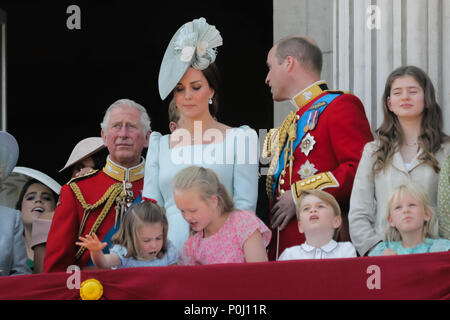 London, UK. 9th June 2018. Princess Charlotte of Cambride takes a tumble on the balcony at Buckingham Palace during the flypast at the end of Trooping the Colour, the Queens Birthday Parade. London Credit: amanda rose/Alamy Live News Stock Photo