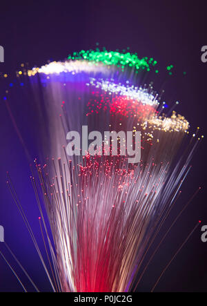 optical fibres dinamic flying from deep on technology background Stock Photo