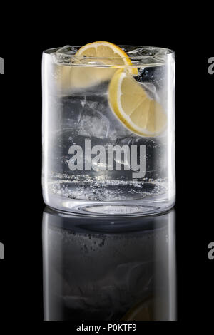 Gin and tonic in Rocks glass isolated on black Stock Photo