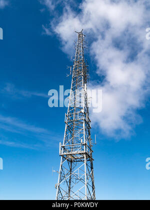 Transmitter radio tv phone mast on the summit of Snaefell, Isle of Man, UK Stock Photo