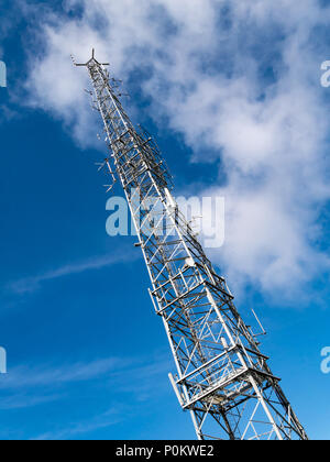 Transmitter radio tv phone mast on the summit of Snaefell, Isle of Man, UK Stock Photo