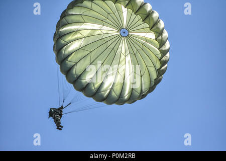 Paratroopers jump onto the Iron Mike drop zone during the 70th ...