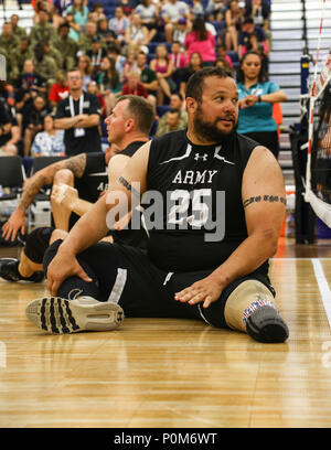 Indoor Rowing Army A Marine participates in an indoor rowing session during the first day ...