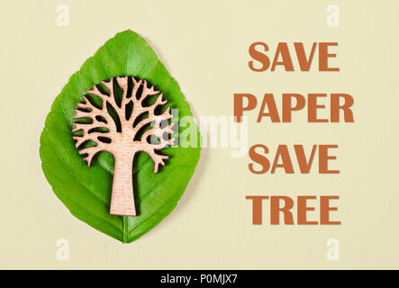 Save paper save tree text with tree and green leaf. Save environment concept. Stock Photo