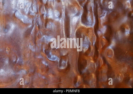 Copper crumpled metal sheet with scratches as background or backdrop Stock Photo