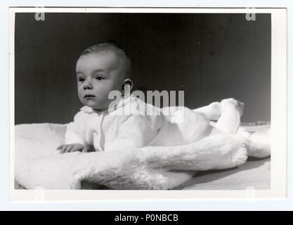 BRNO, THE CZECHOSLOVAK SOCIALIST REPUBLIC, MARCH 10, 1972: Retro photo of  baby boy (six months old).  Portrait photo was taken in photo studio on March 10, 1972. Stock Photo
