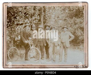 AUSTRIA-HUNGARY, SEPTEMBER 15, 1909:  Vintage photo shows men in nature. Photo was taken in  Austro-Hungarian Empire or also Austro-Hungarian Monarchy, on September 15, 1909. Stock Photo