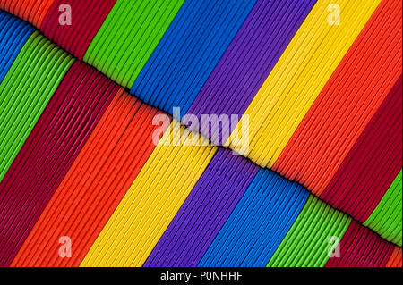 Close-up of multicolored foam craft sticks creating abstract background patterns. Stock Photo