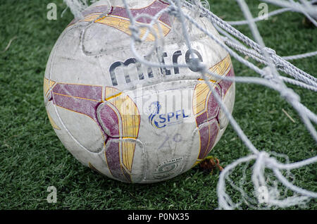 GLASGOW, SCOTLAND - AUGUST 30th 2015: An official SPFL football being used in a girls league match. Stock Photo