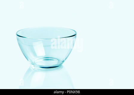 Empty glass bowl on a light background. Copy space. Stock Photo