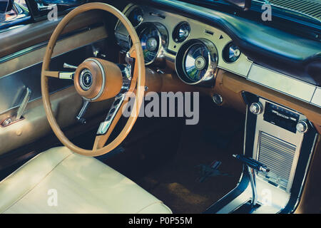 Berlin, Germany - june 09, 2018: Steering wheel, dashboard and interior of Ford Mustang vintage car cockpit at  Oldtimer  event for vintage cars and   Stock Photo