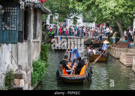 Suzhou, Jiangsu, China.  Boats Take Tourists on Canal Rides in Tongli Ancient Town near Suzhou.  A popular weekend tourist destination. Stock Photo