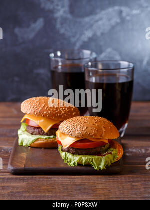 Image of two fresh hamburgers and two glasses of juice