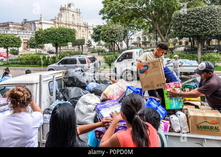 Antigua,, Guatemala -  June 5, 2018:  Volunteers load aid supplies to take to area affected by eruption of Fuego volcano on June 3 Stock Photo