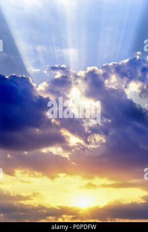 1988 HISTORICAL SUN RAYS THROUGH STORMY CLOUDS Stock Photo