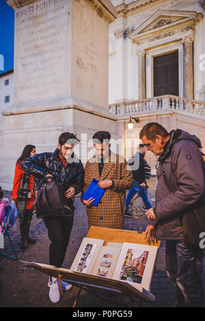 ROME, ITALY - 10 MARCH 2018: artist selling paintings on square Stock Photo