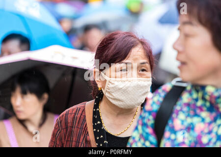 Nanjing, Jiangsu, China.  Chinese Woman Wearing Breathing Mask. Stock Photo