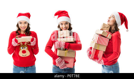 smiling young woman holding stack of christmas gifts isolated on white Stock Photo