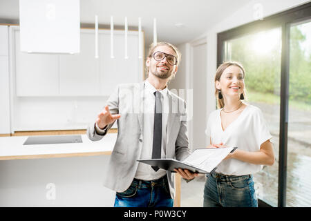 Woman with realtor in the modern apartment Stock Photo