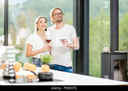 Young couple with wine at home Stock Photo