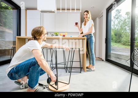 Couple doing house chores at the modern apartment Stock Photo