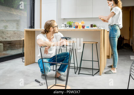 Couple doing house chores at the modern apartment Stock Photo