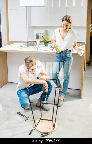 Couple doing house chores at the modern apartment Stock Photo