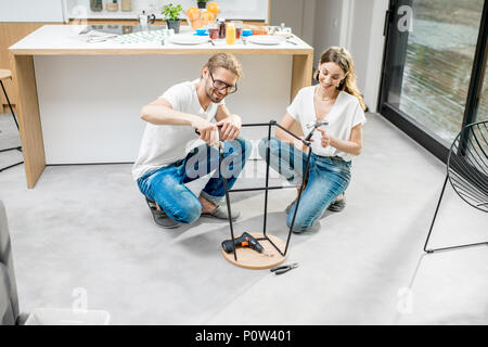 Couple doing house chores at the modern apartment Stock Photo