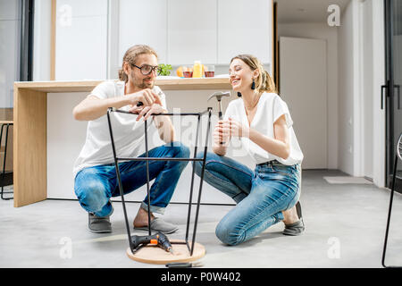 Couple doing house chores at the modern apartment Stock Photo