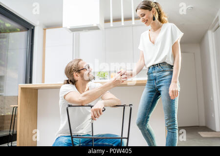Couple doing house chores at the modern apartment Stock Photo