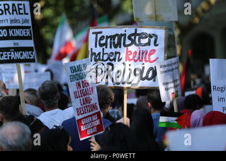 Berlin, Germany. 09th June, 2018. Approximately 2000 participants of the anti-Israel al-Quds demonstration are passing through Berlin. The police accompany the event with the utmost vigilance. Every year it comes to anti-Semitic incitement and crime. The protest now attracts extremists of the political spectrum, from sympathizers of Hamas and Hizballah to neo-Nazis. Motto of the event 'Crusade against Islam? Together against the injustice on the street!'. Credit: Simone Kuhlmey/Pacific Press/Alamy Live News Stock Photo