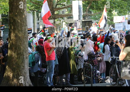 Berlin, Germany. 09th June, 2018. Approximately 2000 participants of the anti-Israel al-Quds demonstration are passing through Berlin. The police accompany the event with the utmost vigilance. Every year it comes to anti-Semitic incitement and crime. The protest now attracts extremists of the political spectrum, from sympathizers of Hamas and Hizballah to neo-Nazis. Motto of the event 'Crusade against Islam? Together against the injustice on the street!'. Credit: Simone Kuhlmey/Pacific Press/Alamy Live News Stock Photo