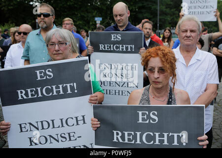 Mainz, Germany. 9th June 2018. Protester stand at the vigil with posters.  who was killed by an Asylum seeker. They also called for both to resign. (Photo by Michael Debets/Pacific Credit: PACIFIC PRESS/Alamy Live News Stock Photo