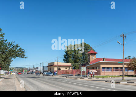 ELLIOT, SOUTH AFRICA - MARCH 28, 2018: A street scene, with the town hall and municipal offices, businesses, vehicles and people, in Elliot in the Eas Stock Photo