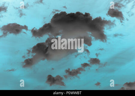 Blue sky with black clouds. toned Stock Photo