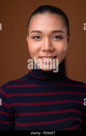 Face of young androgynous Asian transgender woman Stock Photo - Alamy