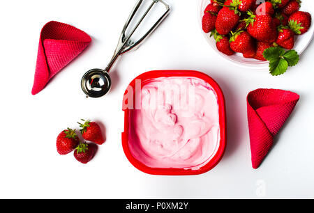 Strawberry ice cream with cones and serving scoop top view Stock Photo
