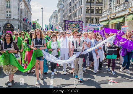 London, UK. 10th June 2018. The front of the march - PROCESSIONS by 14-18 NOW and Artichoke - On 6 February 1918, the Representation of the People Act gave the first British women the right to vote. Artichoke, the UK’s largest producer of art in the public realm, invited women and girls to mark this moment by taking part in a major mass-participation artwork. They walk together in public processions, forming a living portrait of women in the 21st century and a visual expression of equality. celebrating the fight for suffrage. Credit: Guy Bell/Alamy Live News Stock Photo