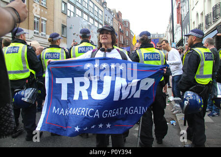 London, UK - 10 June 2018: A female pro-Trump demonstrator by a FRee Tommy Robinson demo group on 10 June 2018.  The Free Tommy Robinson were having a counter demonstration to the Al Quads Day demonstration outside the Saudi Arabian Embassy in  London. The annual event held on the last Friday of Ramadan that was initiated in 1979 to express support for the Palestinians and oppose Zionism and Israel. Credit: David Mbiyu Credit: david mbiyu/Alamy Live News Stock Photo