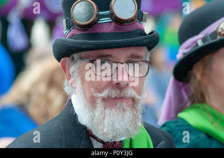 Edinburgh, Scotland, UK. 10th June, 2018. A man dressed in steampunk outfit during the Edinburgh Processions Artwork march celebrating 100 years since British women won the right to vote. Thousands of women came together in the four capitals of the UK,  Belfast, Cardiff, Edinburgh and London. The Participants wore either a green, white or violet scarf and walked in stripes through the city streets to depict the colours of the suffragettes. Credit: Skully/Alamy Live News Stock Photo