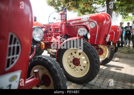 10 June 2018, Germany, Stuttgart: 'UTractors' p of the type Porsche Diesel Super stand together at Porsche's 'Sportscar Together Day'. On 08 June 1948, the first Porsche car, a 356 Roadster, received its permit. Photo: Sebastian Gollnow/dpa Stock Photo