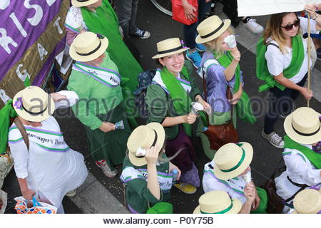 London, UK. 10th June 2018. Glorious weather in London as a march to Westminster took place in honour of the Suffragette movement. A large march wound its way towards Westminster with thousands of jubilant women celebrating 100 years of votes for women. Stock Photo