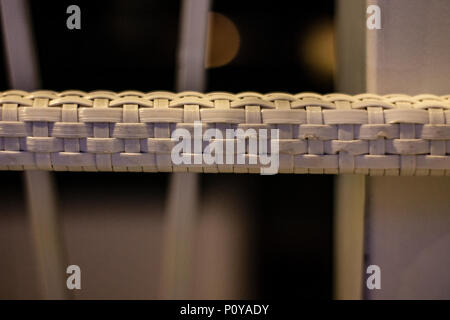 Macro Wicker white braided glossy chair handle Stock Photo