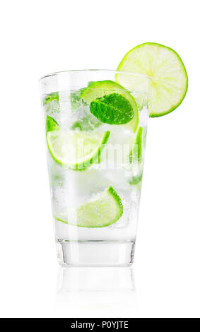 glass of cold lemonade with slices of lime, leaves of mint and cubes of ice isolated on white background Stock Photo