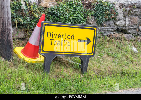 Yellow 'Diverted Traffic' sign. For lost data, alternative routes, delays, roadworks, road maintenance, road works UK, temporary road closure. Stock Photo