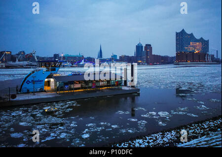 Elbe river under ice, ferry boats, Elbphilharmonie, Hamburg, Germany